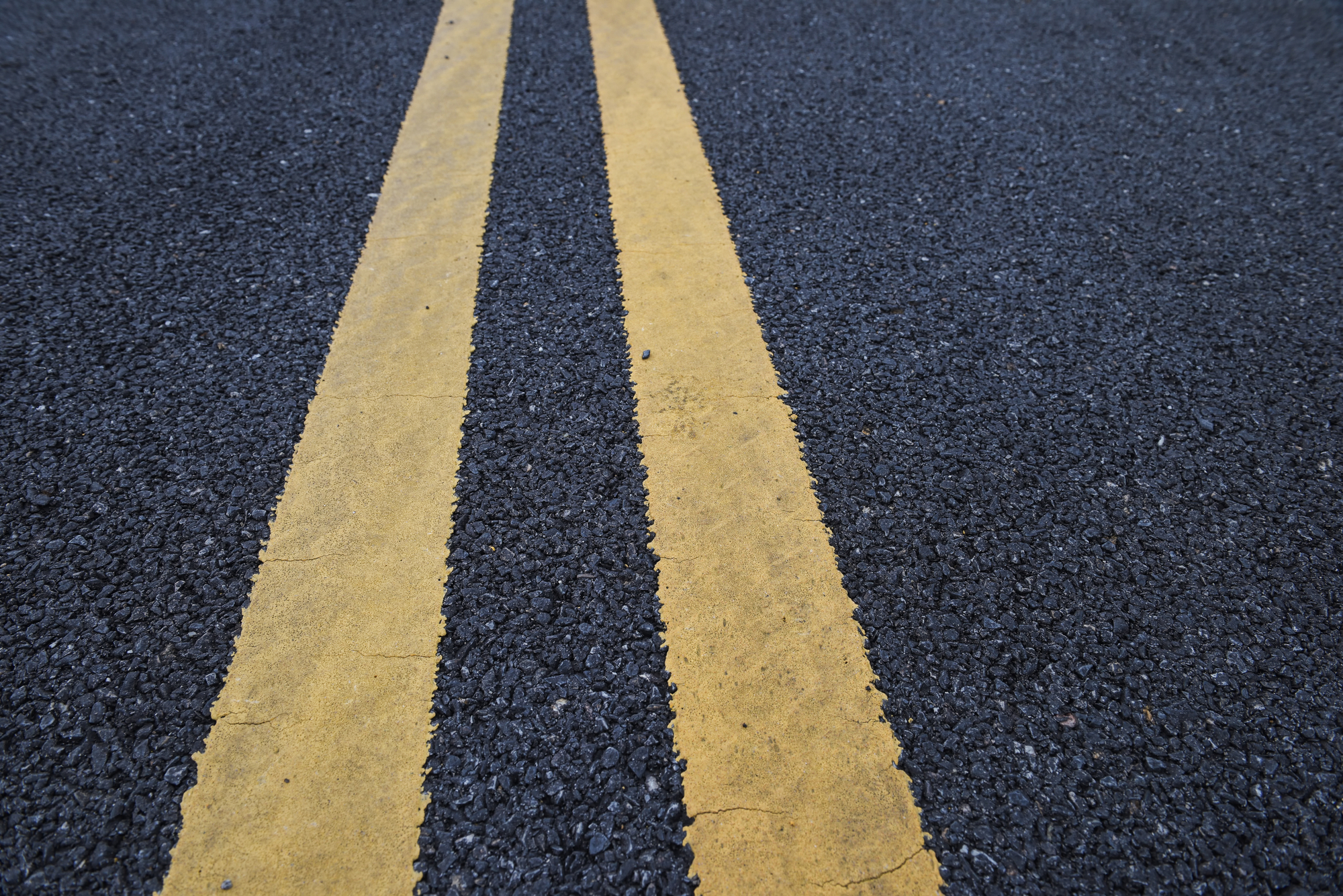 Road Construction Safety Guide - Closeup asphalt road with marking lines for giving directions, traffic lines concept